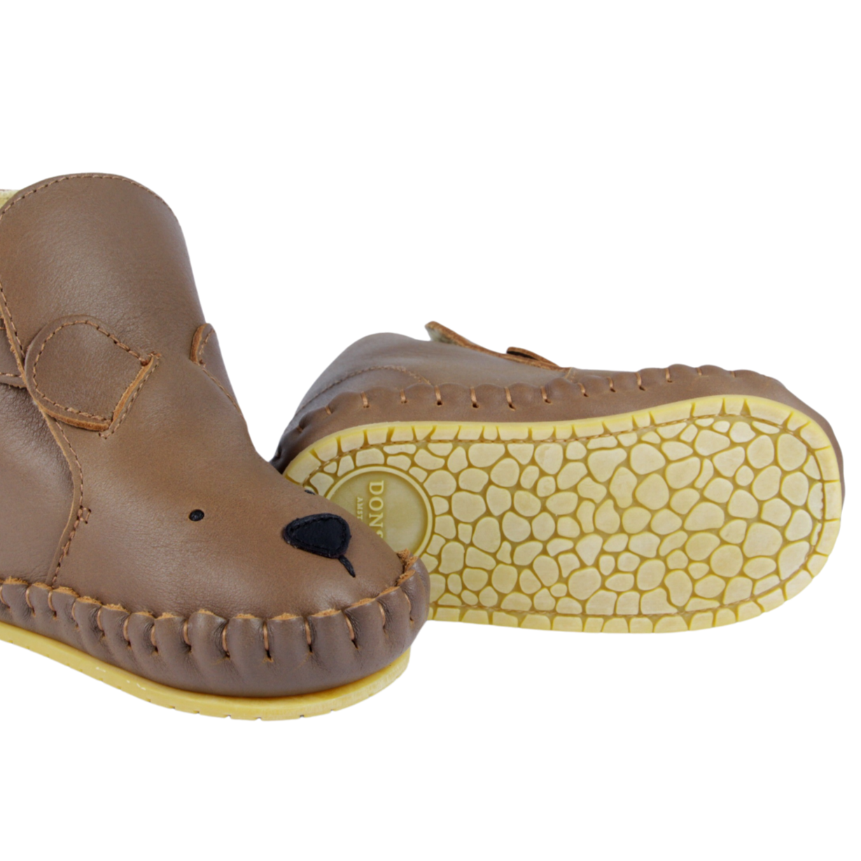 Leren wol gevoerde slofjes in de vorm van een beer voor baby's van het merk Donsje.