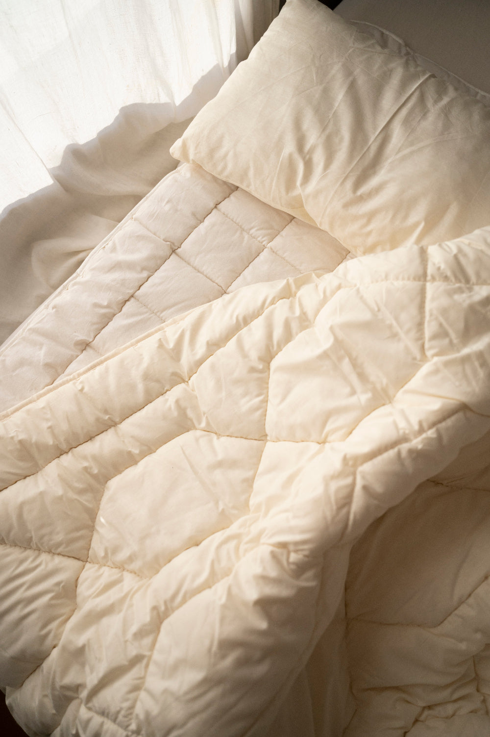 Matrastopper merino wol vulling en dekbad samen