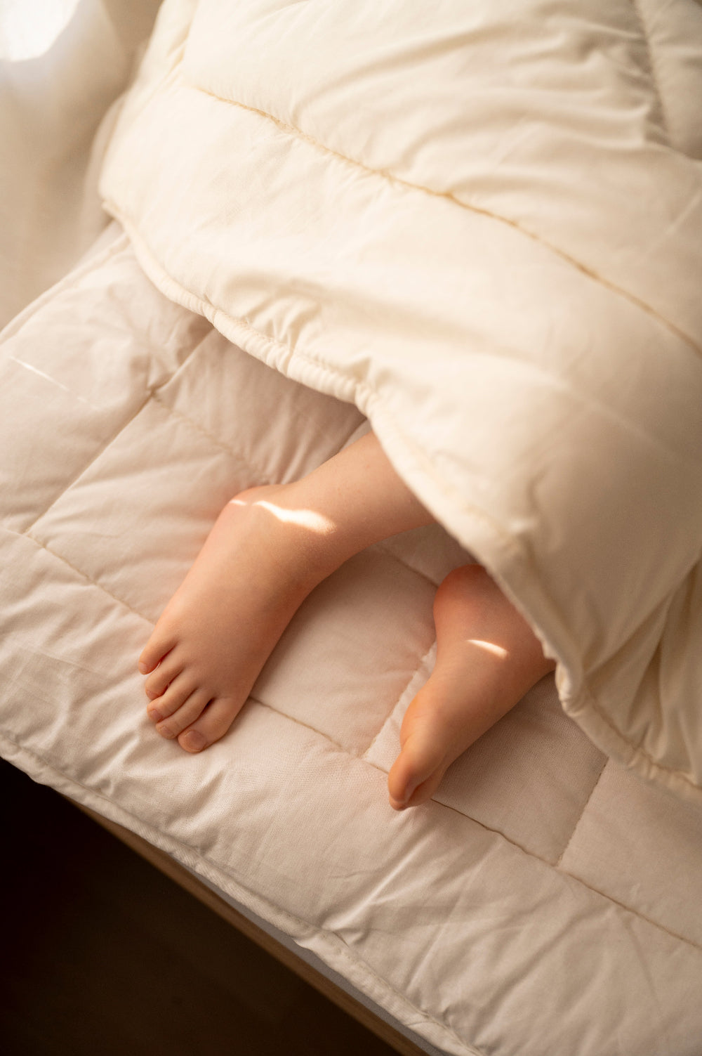 Matrastopper merino wol vulling met voetjes