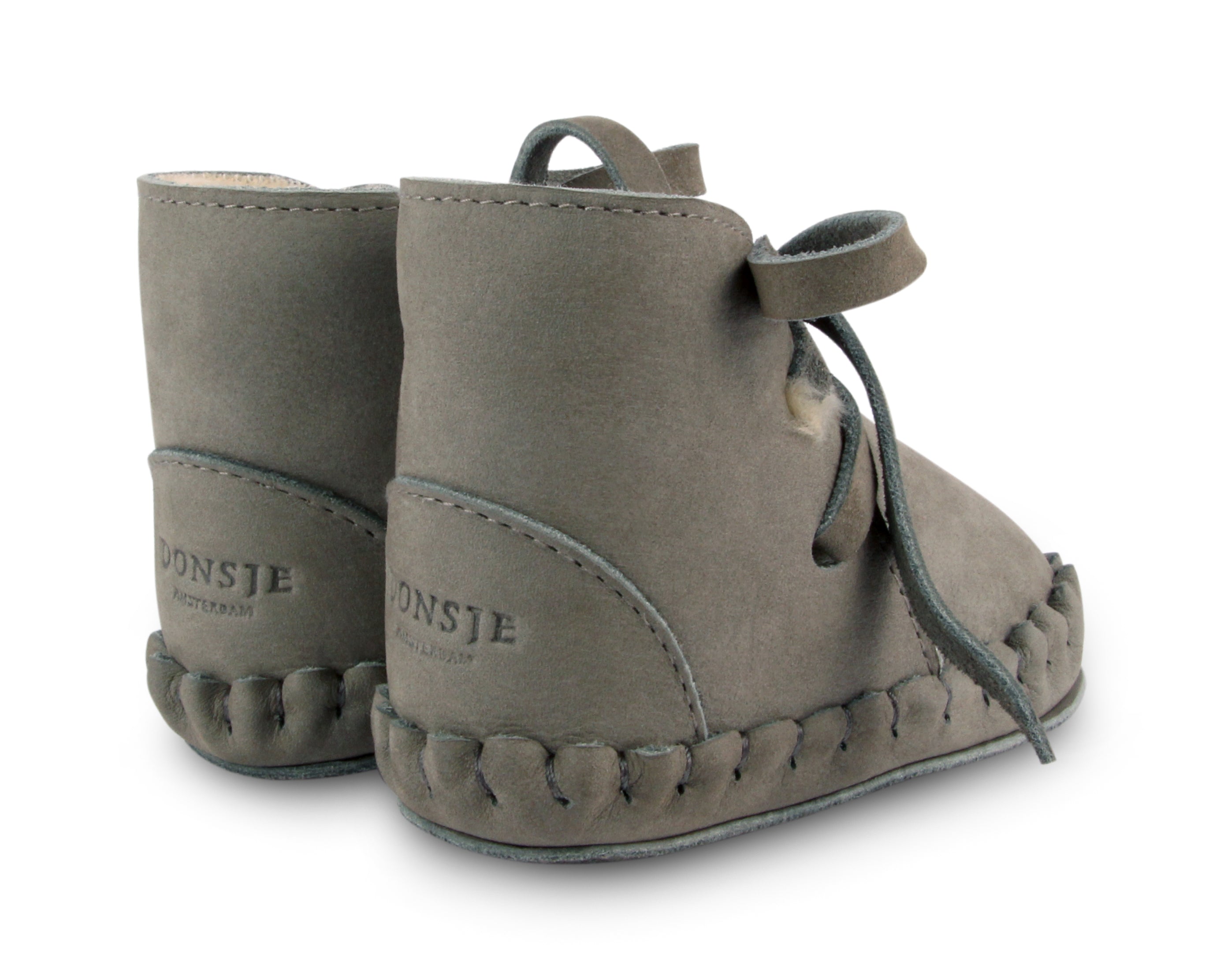 wol gevoerde slofjes voor baby's / kinderen in het groen van donsje.